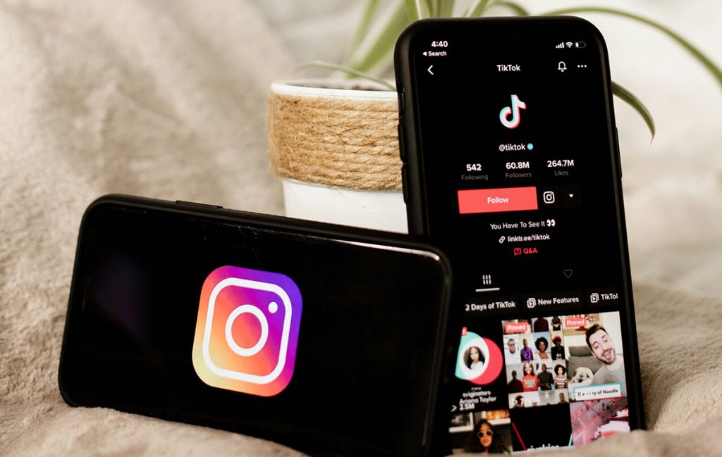 instagram and tiktok showing on smartphone screens