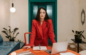 leadership skills business woman wearing red jacket