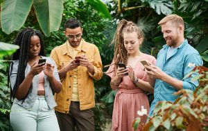 group of people looking at phones