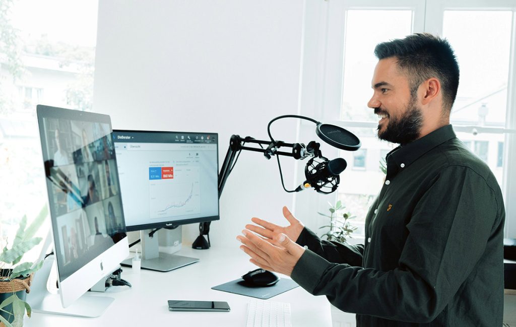 Screen showing webinar and host talking to the audience